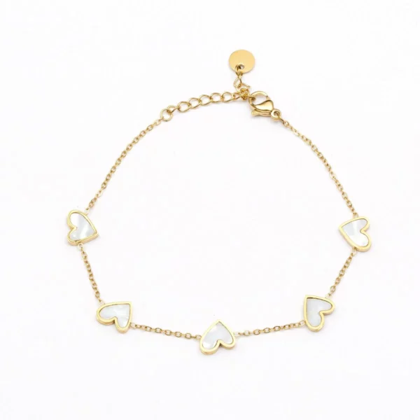 Armband goud witte hartjes